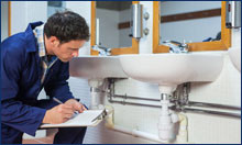 plumber checking sink